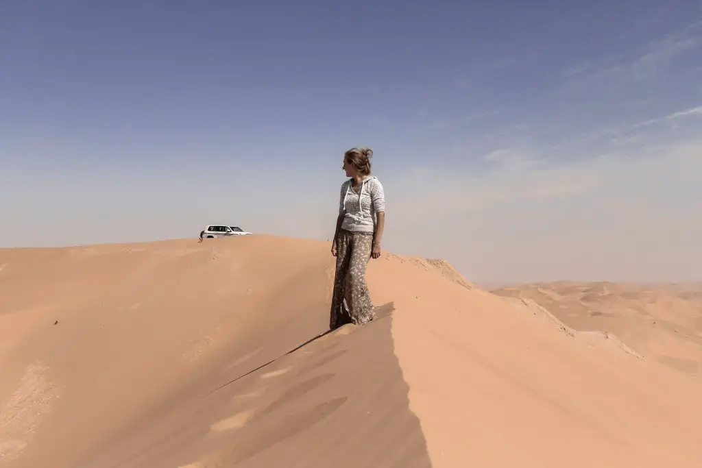 Monica in the Arabian Desert, solo female travel in the Middle East.