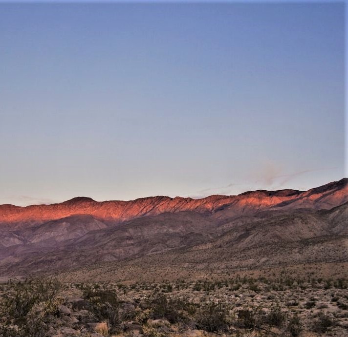 Anza Borrego at sunset with golden light on the mountains.