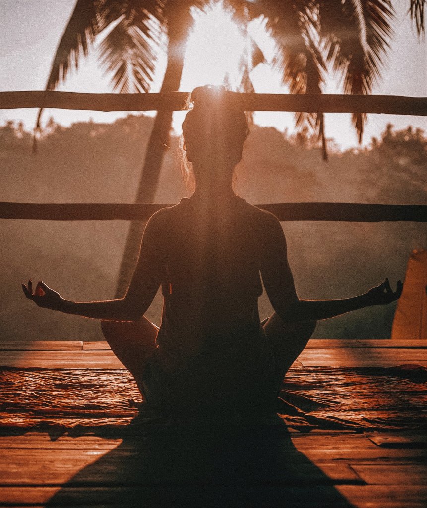 Yoga near the palm trees.