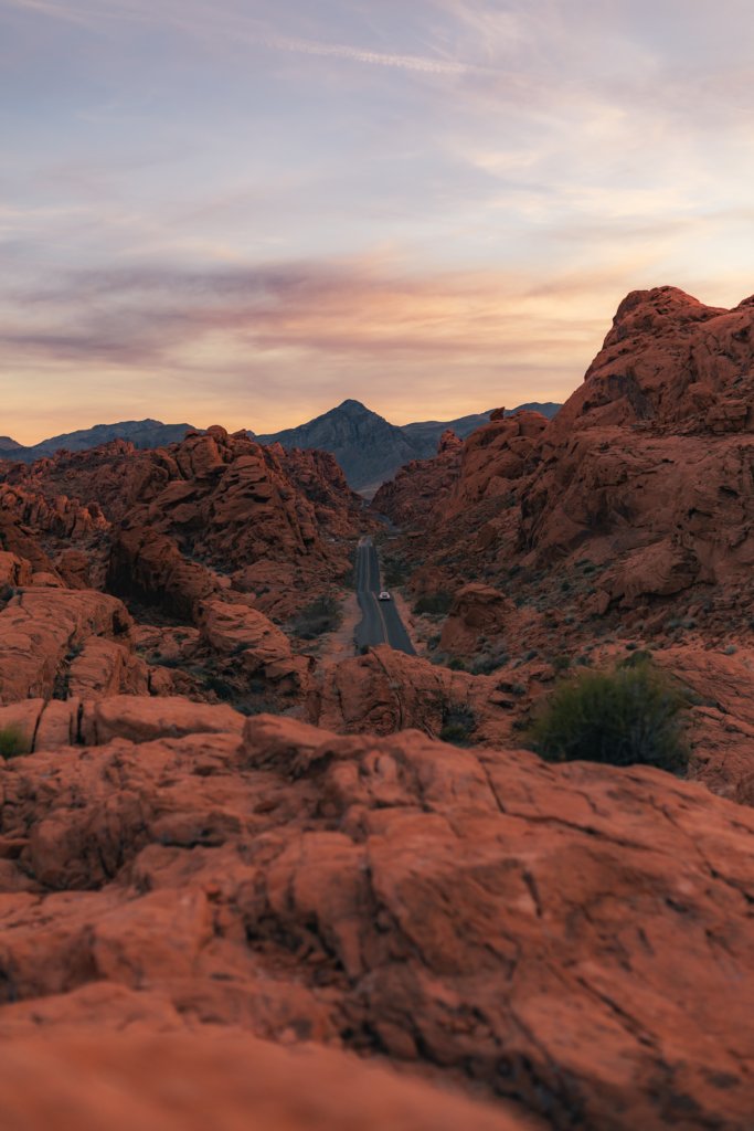 A view of the Valley of Fire State Park red rocks and winding road.