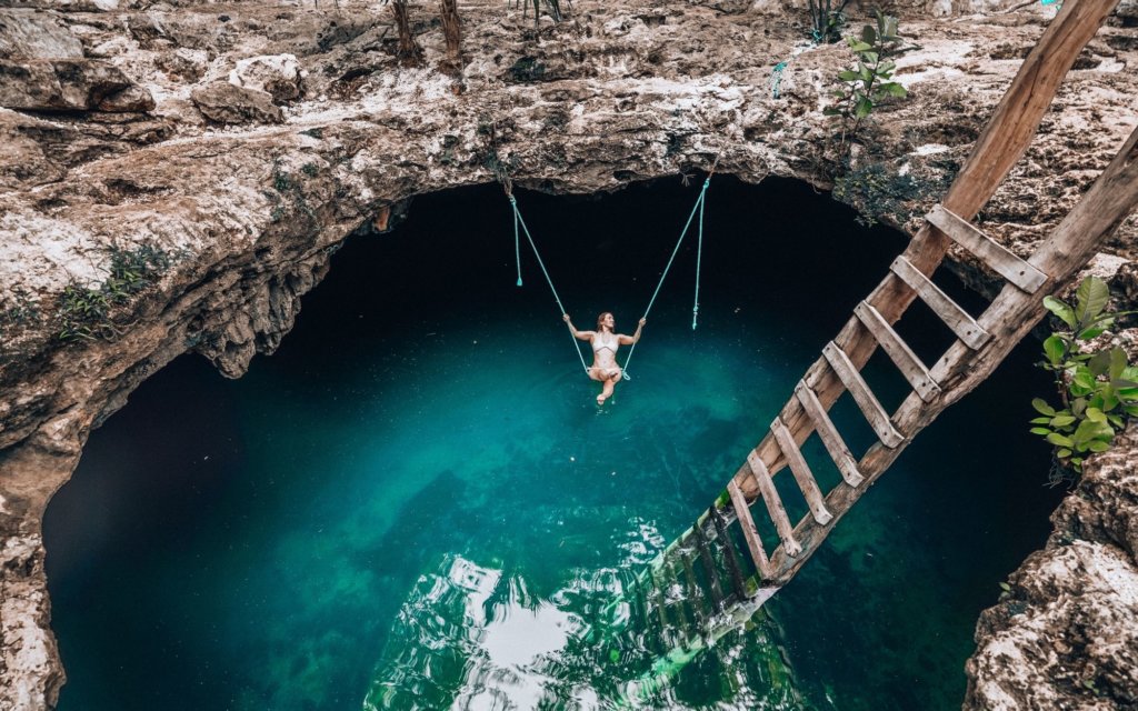 Monica inside of a cenote, one of the top Things to Do in the Yucatan Peninsula.