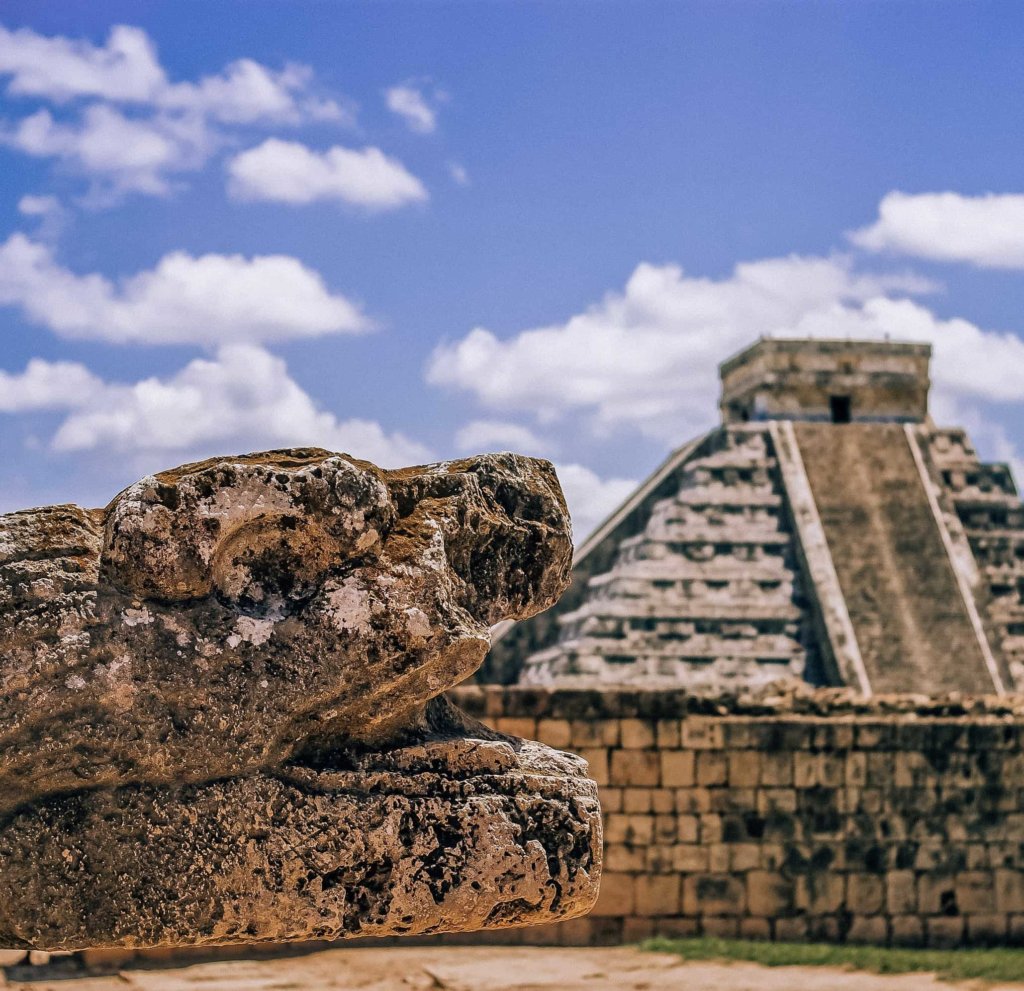 Chichen Itza pyramid with a blue sky.