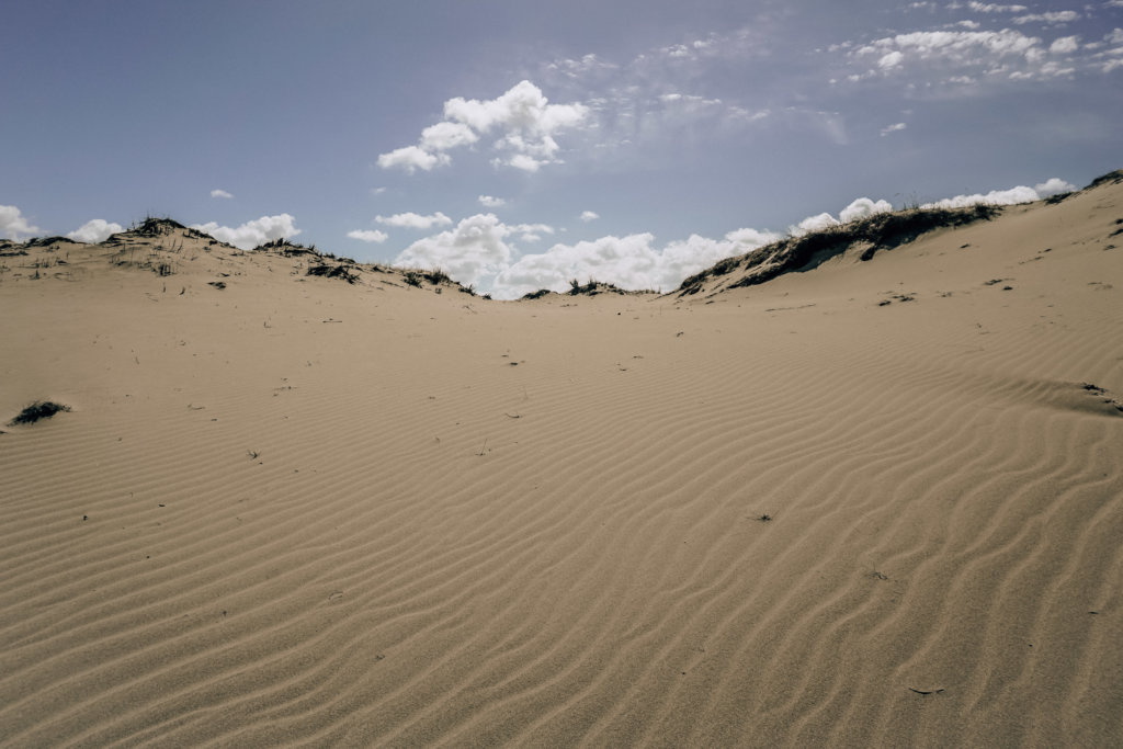 Giant sand dunes are one of the top places to visit in Lithuania!