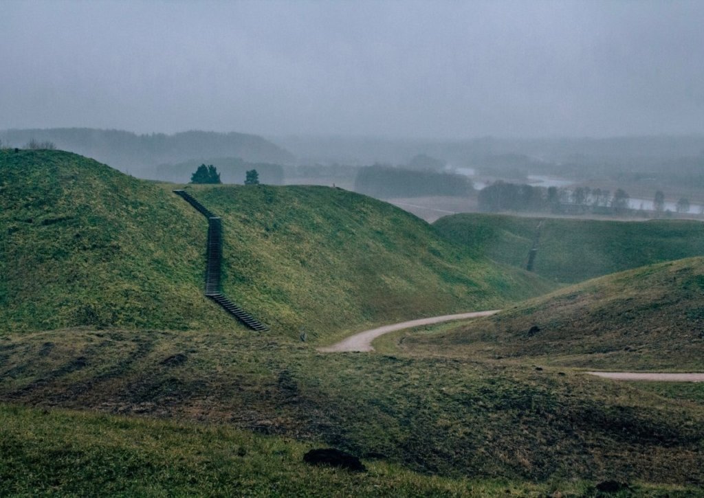 Fog over the hills of Kernave - one of my top recommendations on places to visit in Lithuania.