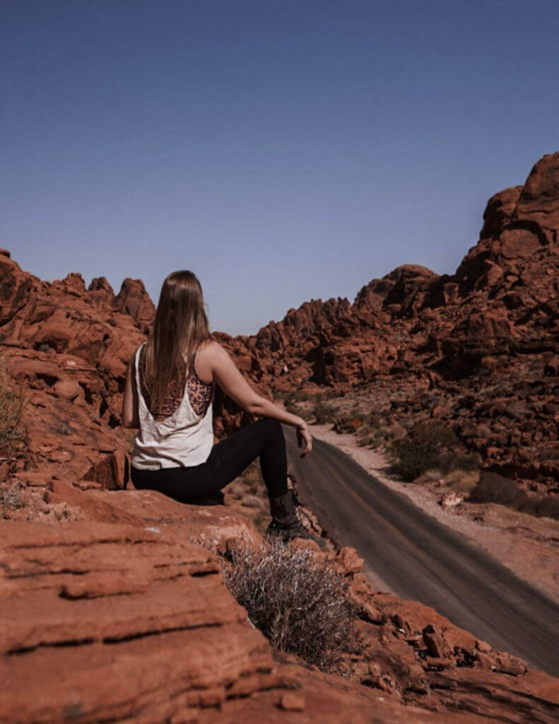 Monica reflecting in Nevada - Reasons to Travel Alone This Year. 