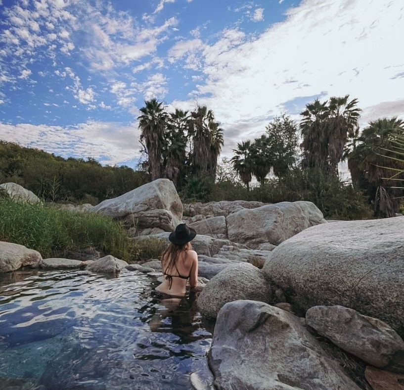 Monica in the hot springs in the Sierra de la Laguna mountains, which is stop #3 on your road trip in Baja.