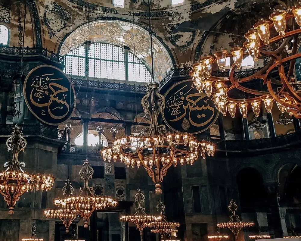 The Hagia Sophia interior, with dark walls and bright lights.
