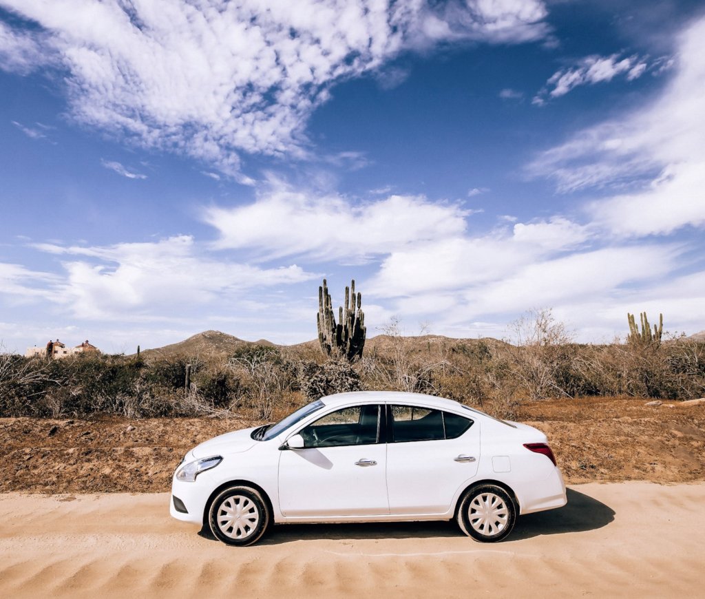 A white car on a road trip in Baja California.