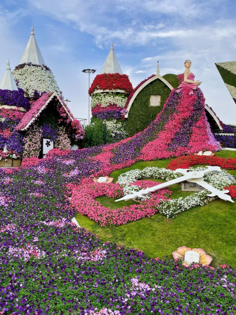 Bright pink, purple and red flower sculptures at the Dubai Miracle Gardens.