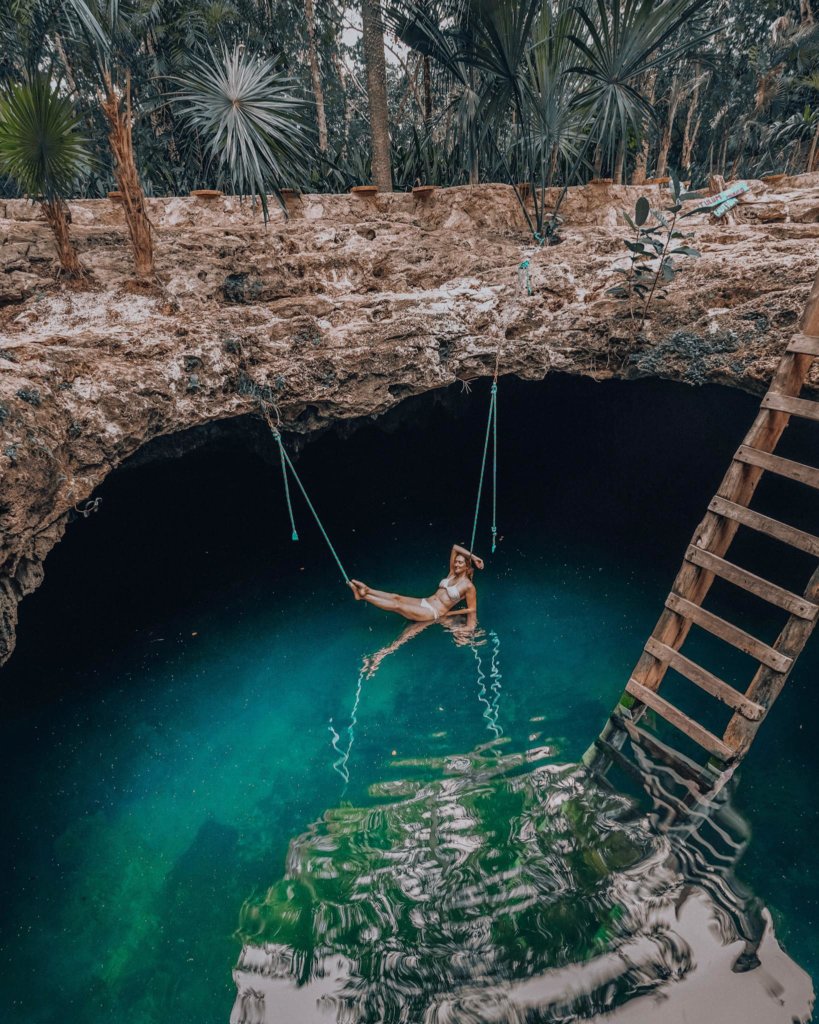 Monica lounging near the turquoise waters of Cenote Calavera.