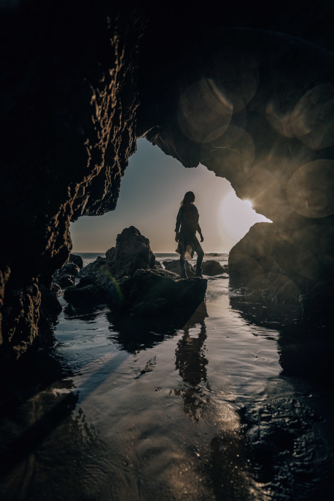 Monica standing on the rocks and caves in El Matador Beach Malibu.