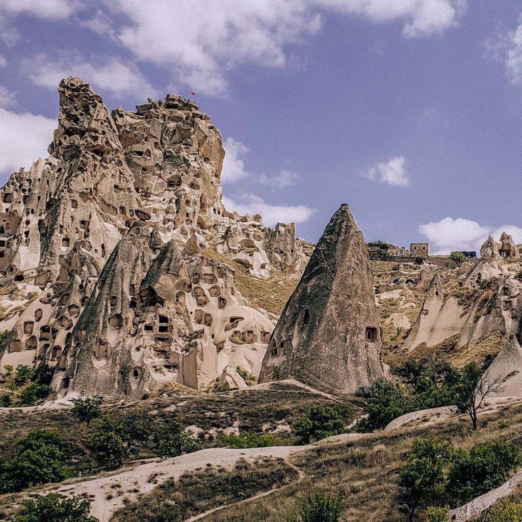 Cave houses in front of the blue sky.