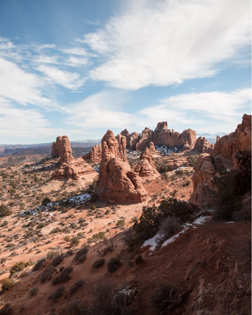 A stunning view of rocks jutting up from soil in Arches.