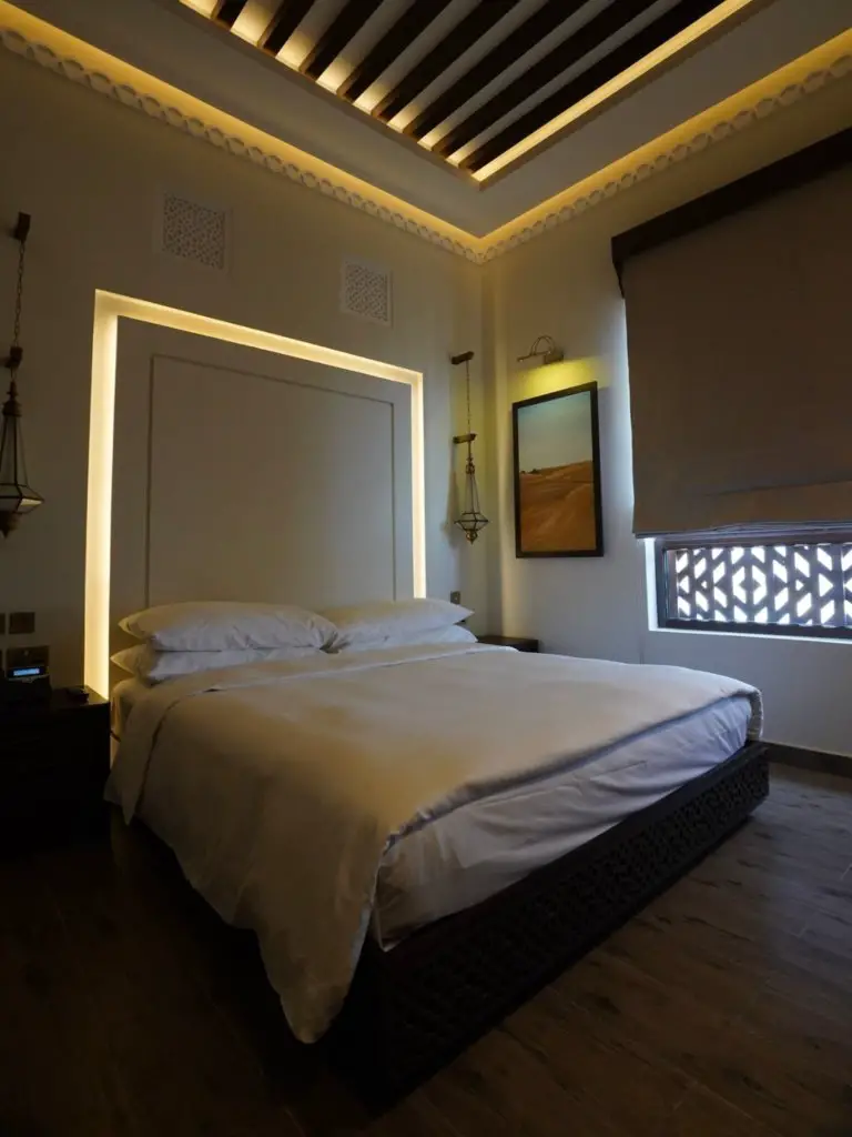 The crisp white bedding inside the Mysk al Badayer Retreat hotel room.