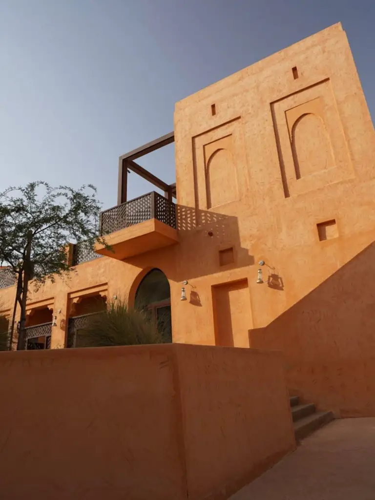 The orange walls of the Mysk al Badayer Retreat.