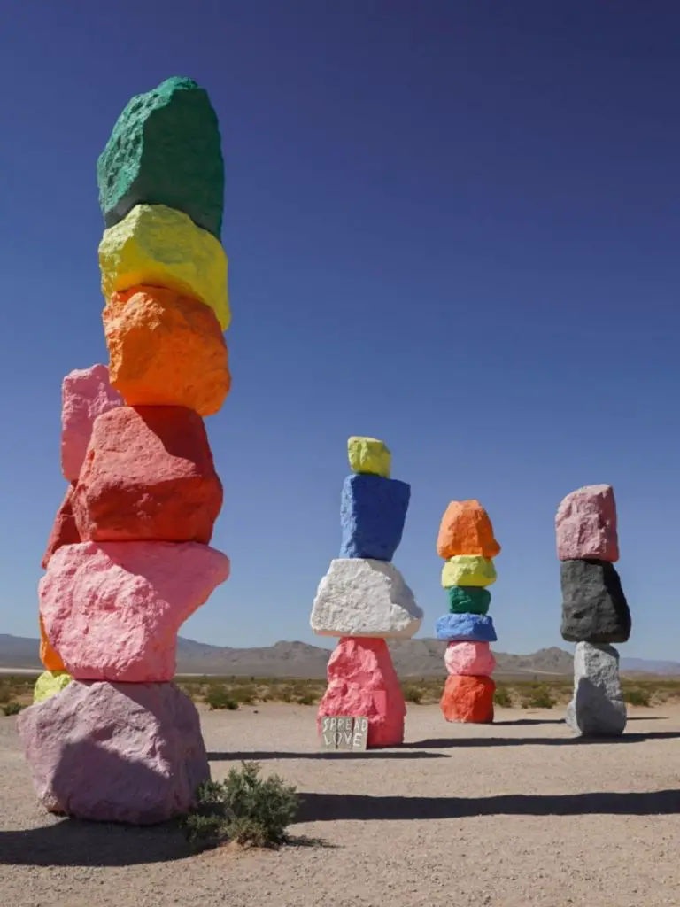 Four of the Seven Magic Mountains art installation in the desert - tall colorful rocks outside of Las Vegas.