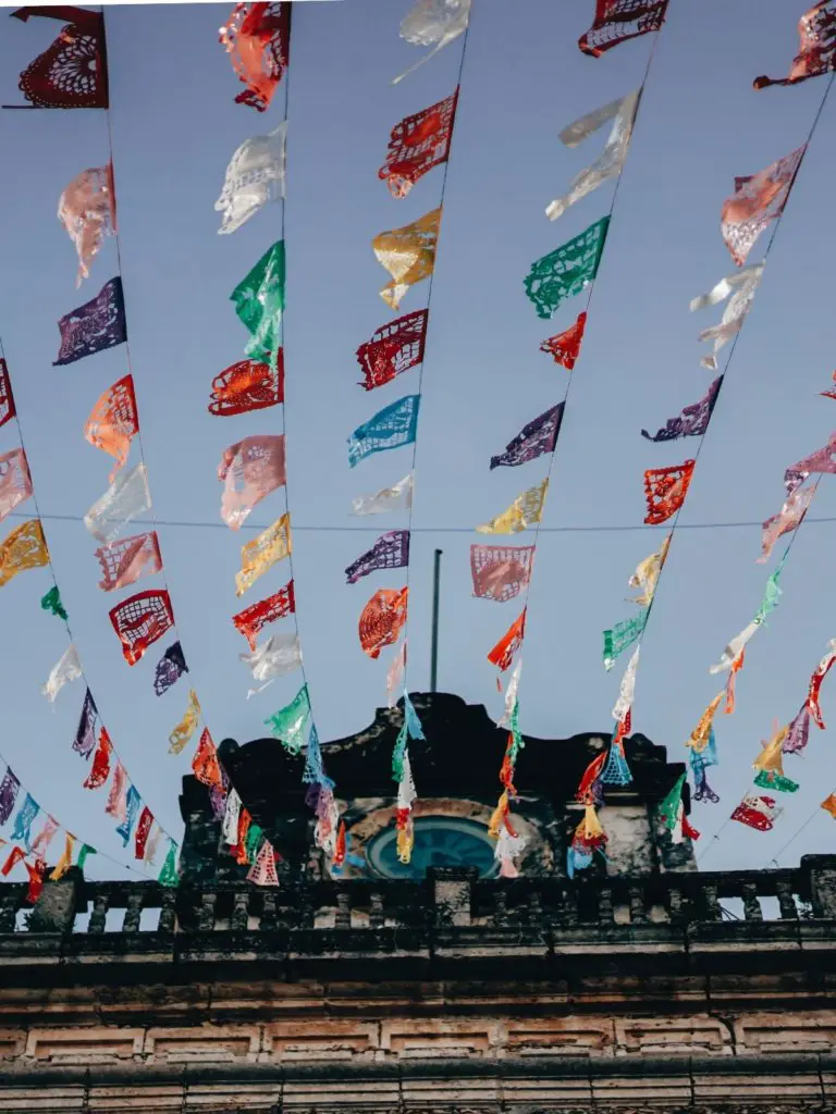 Colorful flags in front of the blue sky - holidays and festivals.