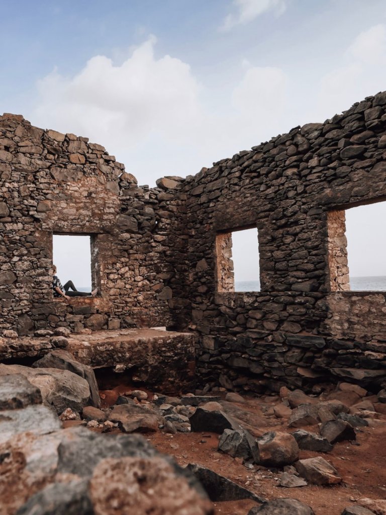 Sitting at the gold mill ruins, gazing t the sea - Unique Things to Do in Aruba.