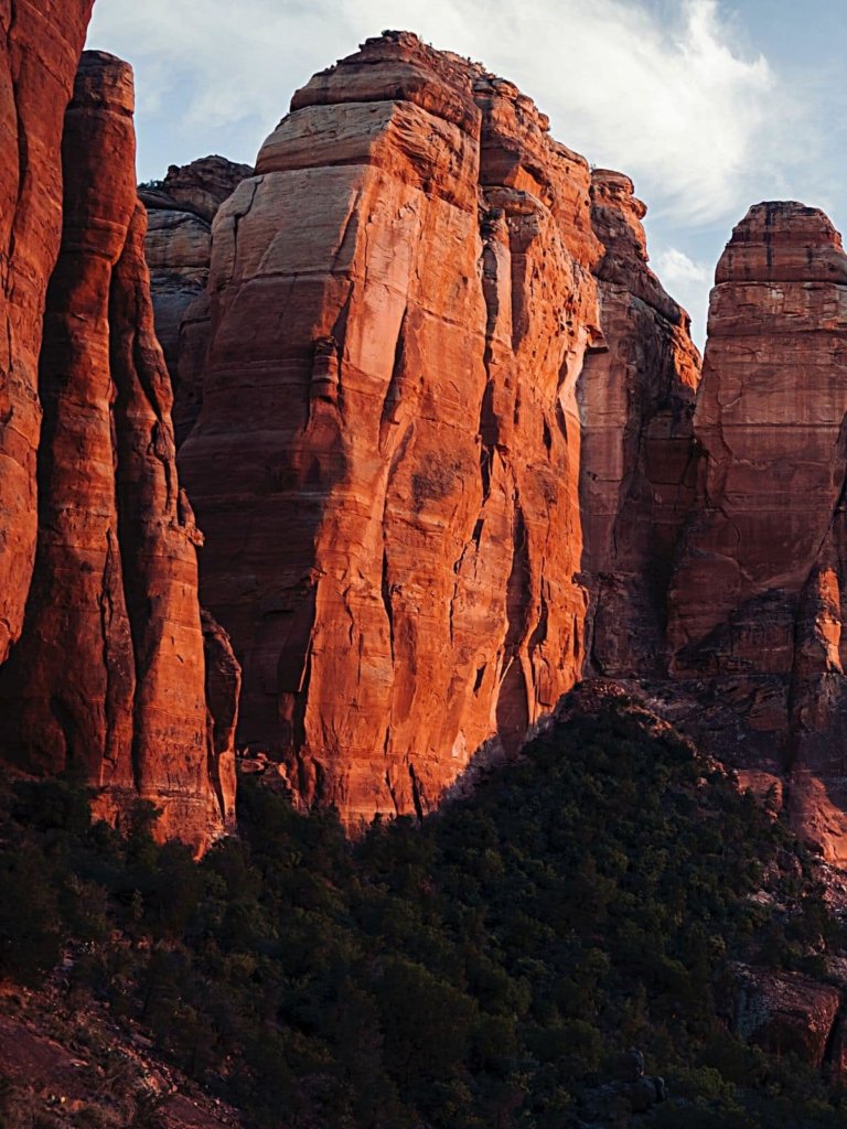 The stunning red Cathedral Rock towering up into the sky -  one of the most Unique places to visit in Sedona, Arizona.