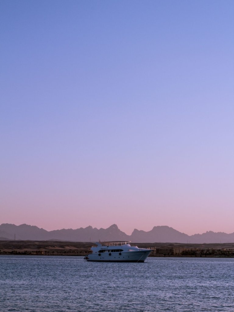 A cotton candy sunset over the ocean - one of the best places to go in Cairo Egypt!