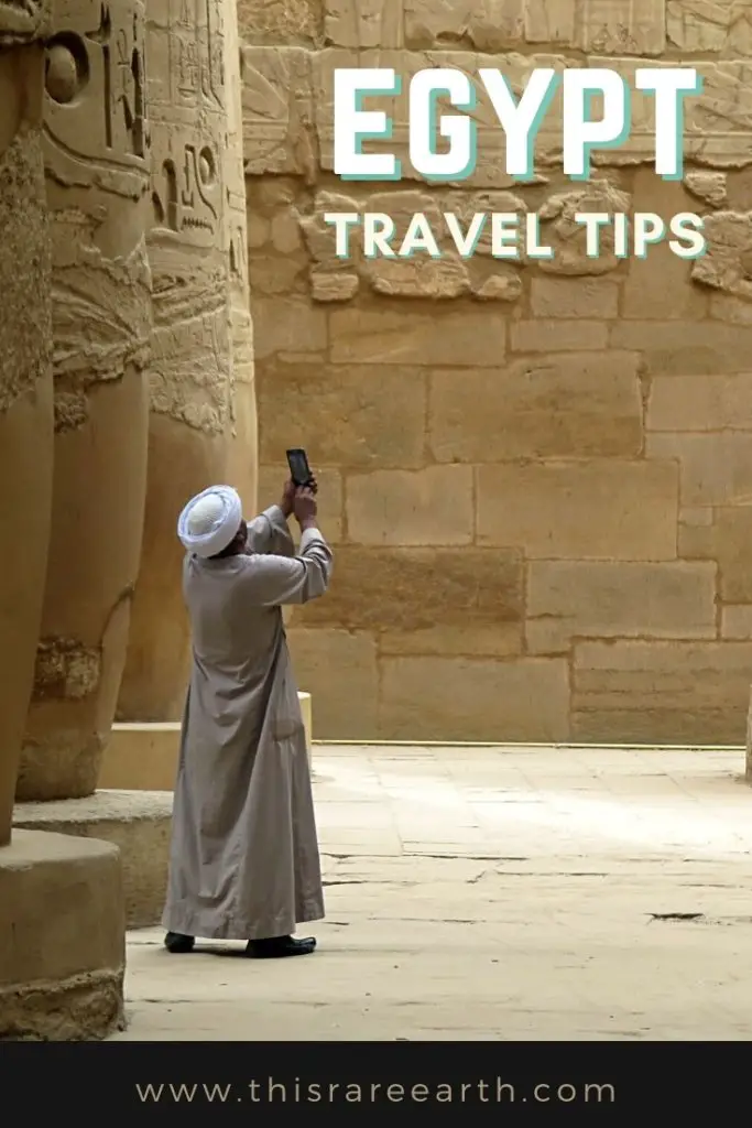 Egypt Travel Tips pin featuring man at Karnak