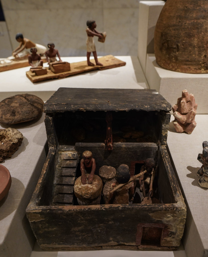 Small clay and wooden sculptures seen while Visiting the National Museum of Egyptian Civilization in Cairo, Egypt.