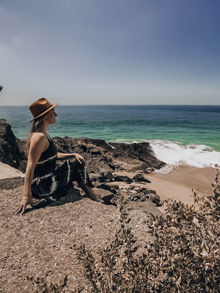 Monica on a cliff along the Pacific coast on her day trip to Malibu.