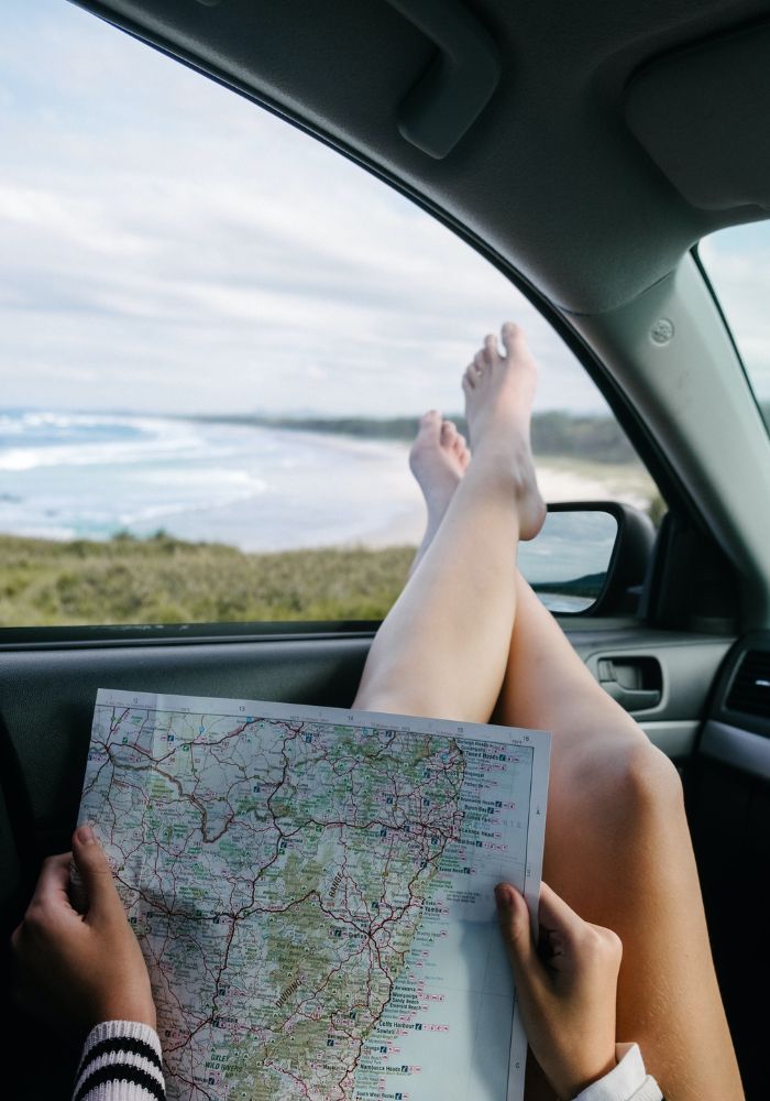 The cons of travel with friends - you don't have full control of the itinerary. Girl holding a map.