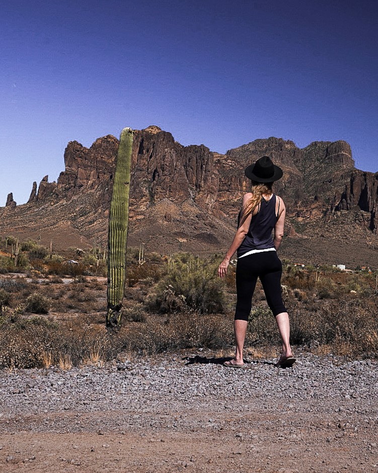 Monica and a tall skinny saguaro cactus near the Superstition Mountains - a nice addition to any Phoenix itinerary.