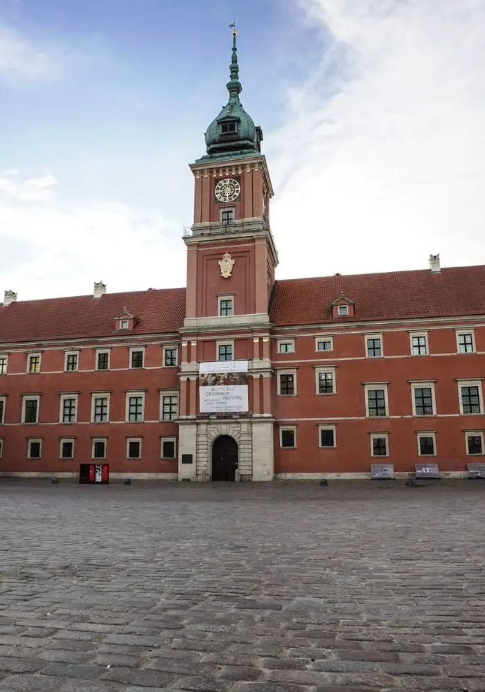 The peachy-red colored Royal Castle, now a museum, one of the fun things to do in Warsaw.