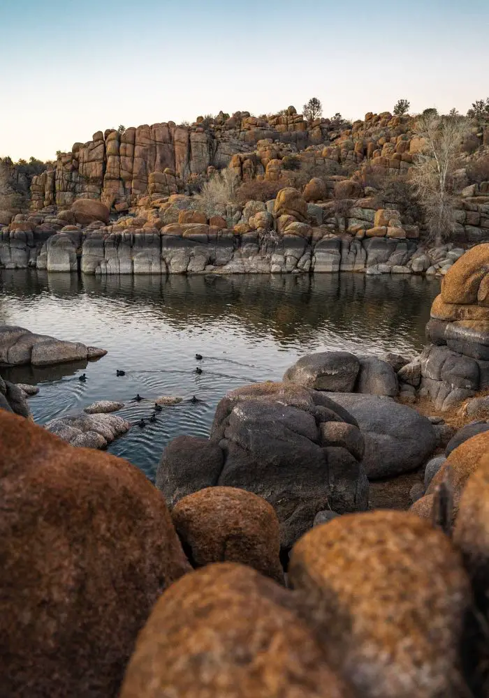 The rock-covered lake in Prescott, one of The Best Day Trips From Phoenix, Arizona.
