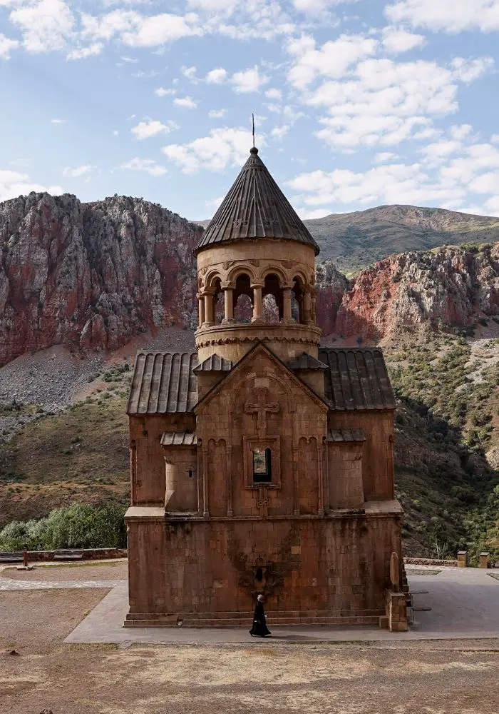 A priest at Noravank Monastery, n front of the Holy Mother of God Church.