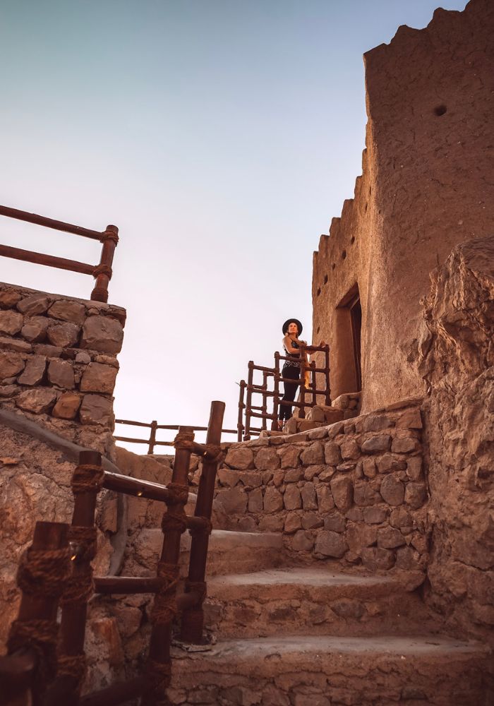 Climbing the Dhayah Fort at sunset; one of Places to Visit in Ras Al Khaimah.