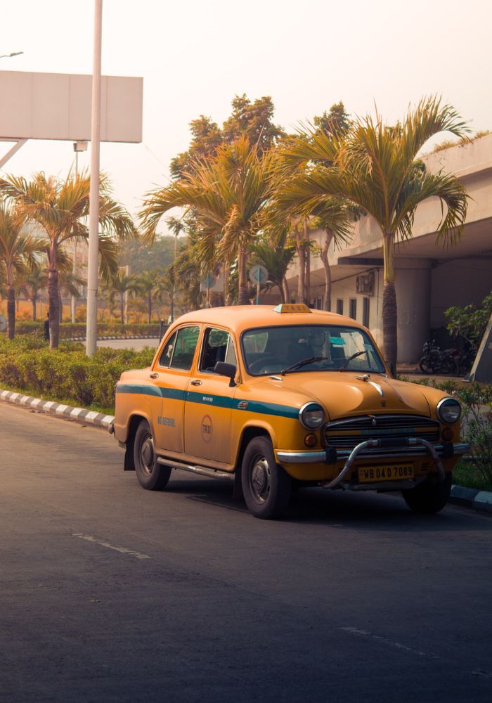 A parked taxi in India - Solo Female Taxi Safety Tips .