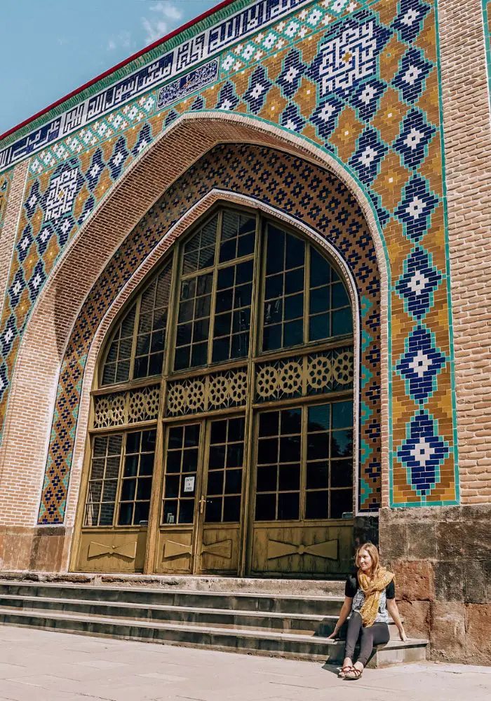 Monica in front of The Blue Mosque tilework - one of The Best Places to Visit in Armenia.