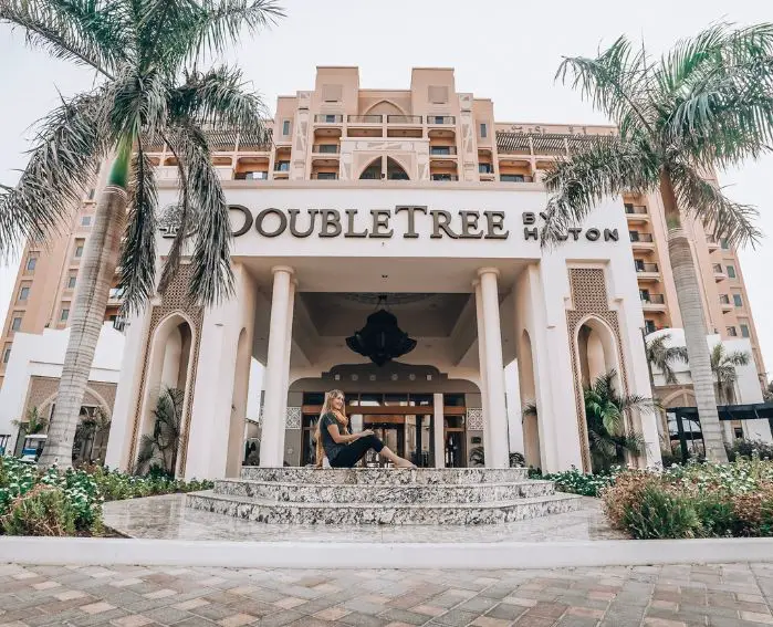 Monica in front of the DoubleTree by Hilton at Marjan Island - one of the best Places to Visit in Ras Al Khaimah.