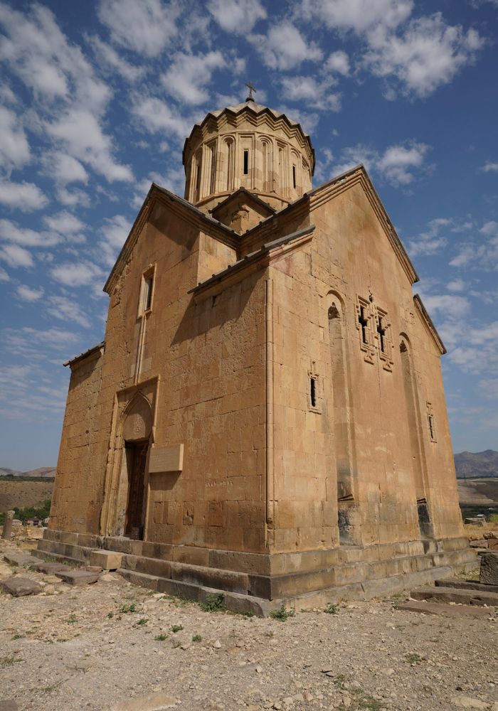 The small Holy Mother of God Church against blue skies - a great place to visit on your One Week Armenia Itinerary.