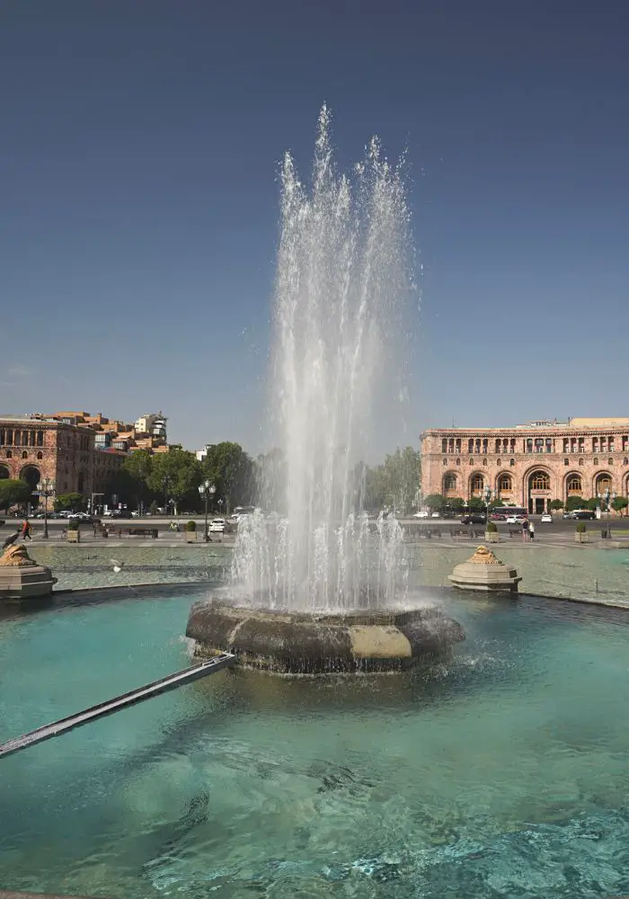 The clear blue fountain in Republic Square, one of the best places to visit in Yerevan, Armenia.