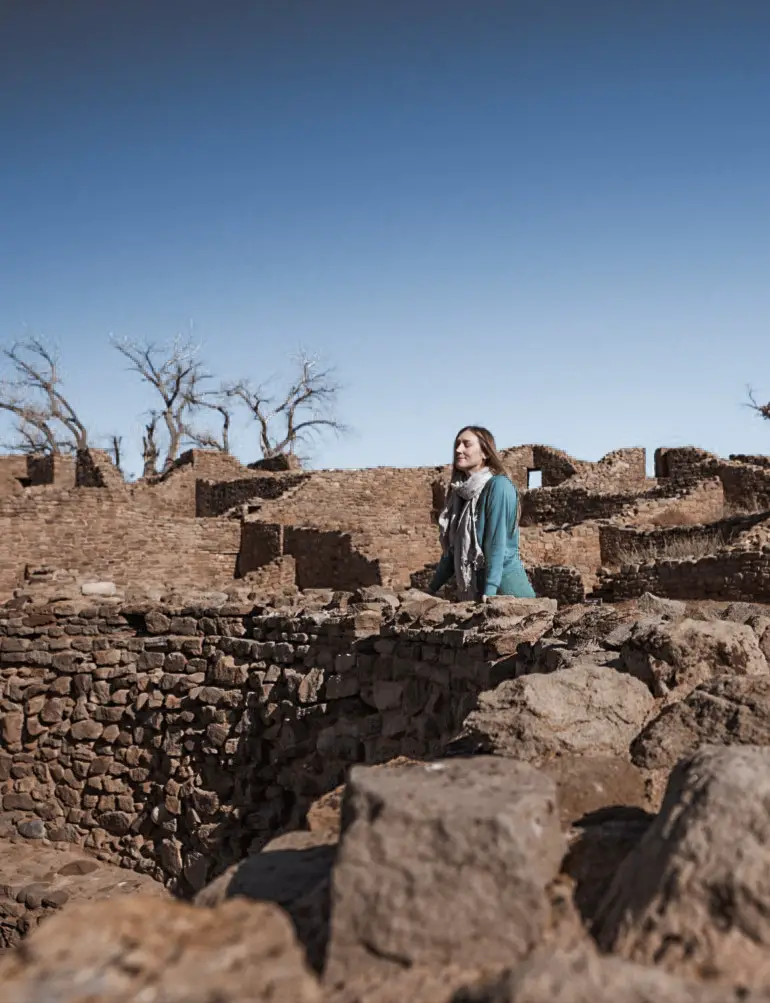 Monica at the Aztec Ruins kiva, a must see after your Albuquerque to Santa Fe Road Trip.