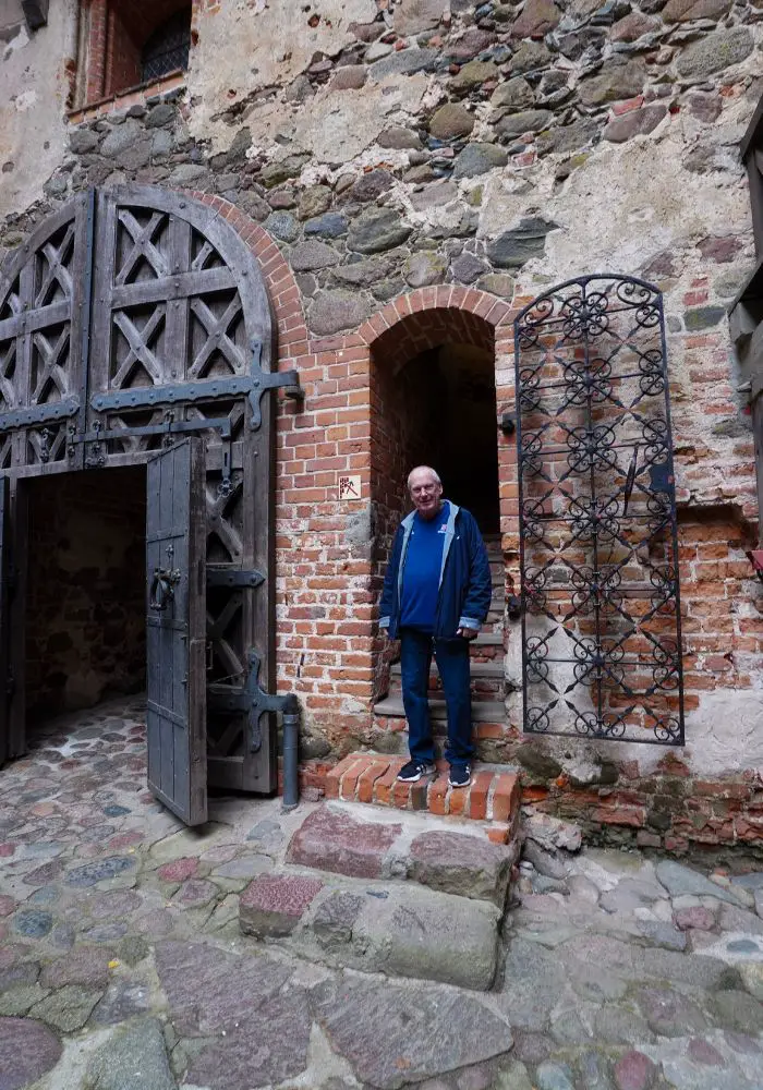 My father exploring the interior of Trakai Island Castle in Lithuania.