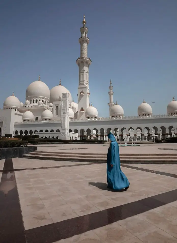 Monica walking through the mosque - sure on what and what not to do in Dubai.