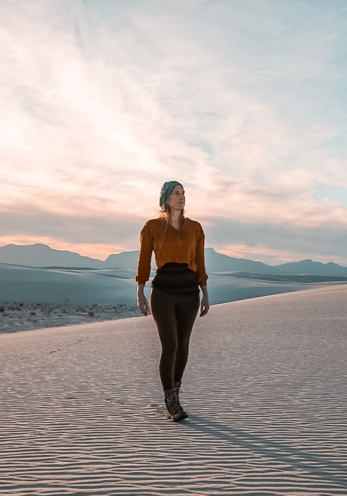 Monica hiking the dunes, one of the best Things to Do in White Sands National Park, New Mexico.