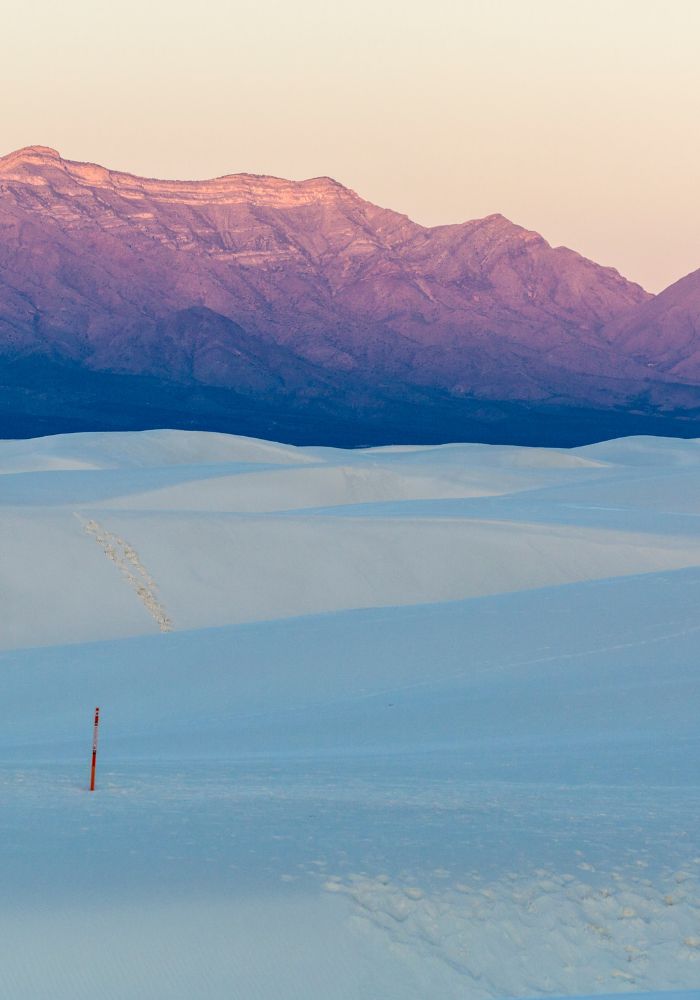 The glow of sunset during a desert hike, one of the best Things to Do in White Sands National Park, New Mexico.