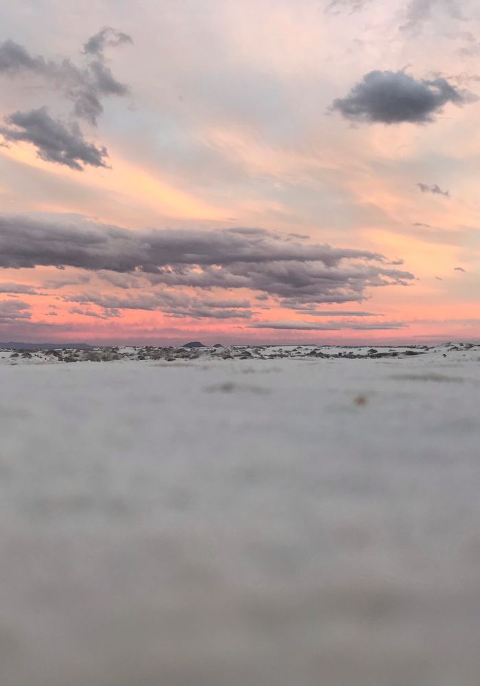 Pink cotton candy skies on a hike, one of the best Things to Do in White Sands National Park, New Mexico.