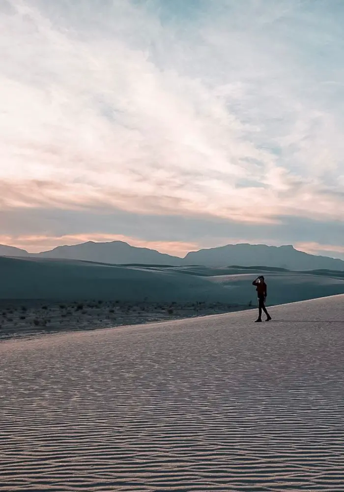 Monica exploring White Sands National Park at sunset, one of your New Mexico Road Trip stops.