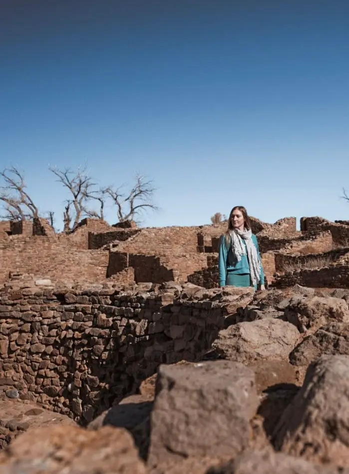 Monica exploring the Aztec Ruins, one of your New Mexico Road Trip stops.