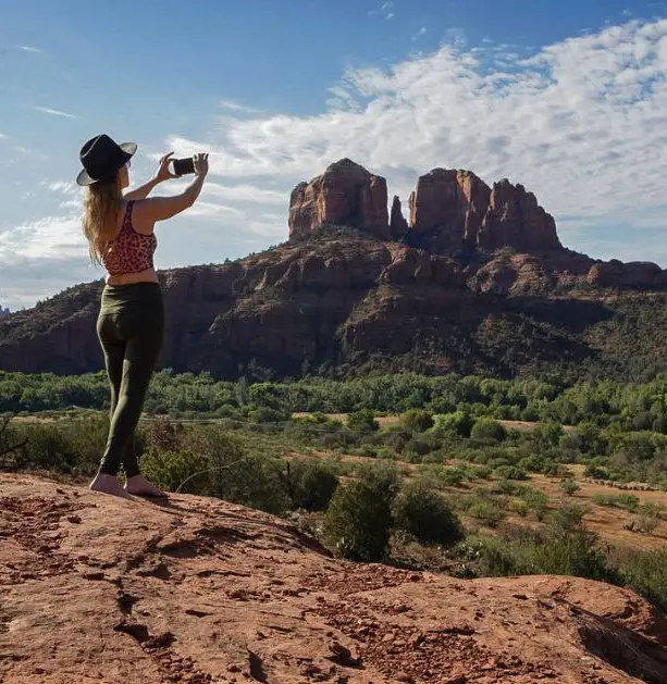 Things to Do on a Road Trip with Friends - Monica taking a photo in Sedona.