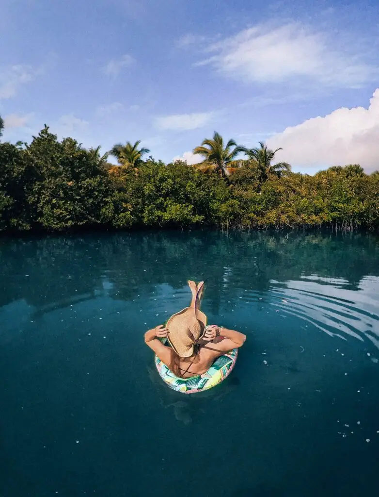 Monica floating in the blue lagoon, Visiting Peanut Island, Florida.