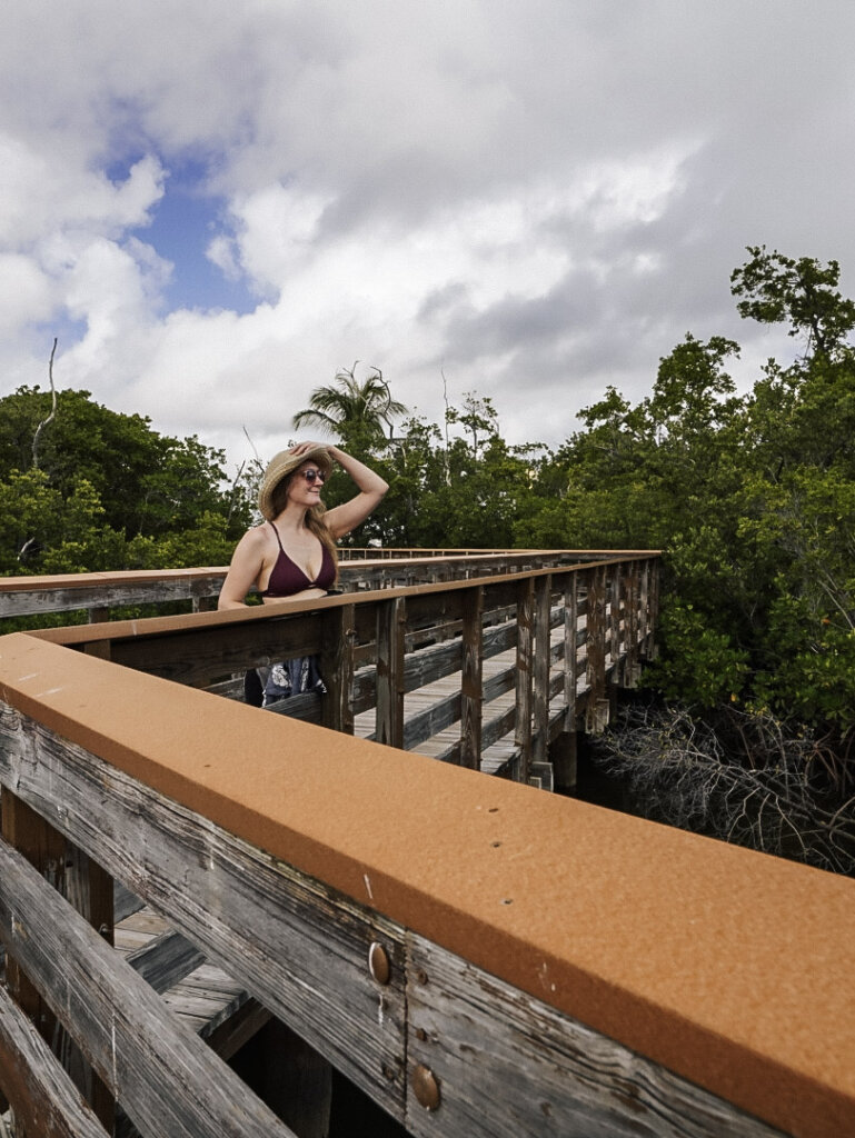 Monica walking the boardwalk path, Visiting Peanut Island, Florida.