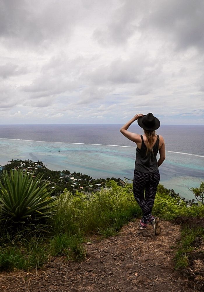 Monica on top of Magic Mountain, one of Things To Do in Moorea, French Polynesia.
